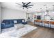 Open concept kitchen and living area with modern appliances and hardwood floors at 523 Brookeshire Dr, Davenport, FL 33837