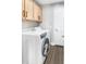 Laundry room with washer, dryer, and upper cabinets at 523 Brookeshire Dr, Davenport, FL 33837