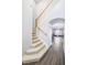 Elegant staircase with carpeted steps and wooden handrail at 523 Brookeshire Dr, Davenport, FL 33837