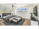 Spacious bedroom with wood-look floors and large windows at 5524 Meander Dr, Lake Wales, FL 33898