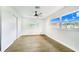 Bright bedroom, featuring hardwood floors and dual windows at 5524 Meander Dr, Lake Wales, FL 33898