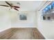 Spacious bedroom with hardwood floors and large windows at 5524 Meander Dr, Lake Wales, FL 33898