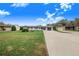Newly renovated home with white exterior, black accents, and a large yard at 5524 Meander Dr, Lake Wales, FL 33898