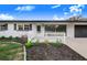 White ranch home with black accents and picket fence at 5524 Meander Dr, Lake Wales, FL 33898