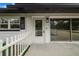 Inviting front entrance with white picket fence at 5524 Meander Dr, Lake Wales, FL 33898