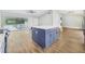 Kitchen island with white quartz countertop and blue cabinets at 5524 Meander Dr, Lake Wales, FL 33898