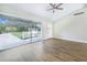 Bright living area with sliding glass doors and wood floors at 5524 Meander Dr, Lake Wales, FL 33898