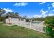 White house with a fenced-in pool and backyard at 5524 Meander Dr, Lake Wales, FL 33898