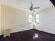 Bright bedroom with dark carpet and ceiling fan at 635 Waterfern Trail Dr, Auburndale, FL 33823