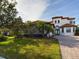 Two-story home with brick driveway and landscaping at 635 Waterfern Trail Dr, Auburndale, FL 33823