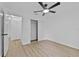 Bright bedroom with wood-look floors and ceiling fan at 735 Avenue R Ne, Winter Haven, FL 33881