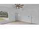 Open living area with light floors and a view into the kitchen at 735 Avenue R Ne, Winter Haven, FL 33881