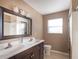 Bathroom with double vanity and tiled flooring at 808 Lake Elbert Ct, Winter Haven, FL 33881