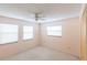 Bedroom with ceiling fan and two windows at 808 Lake Elbert Ct, Winter Haven, FL 33881