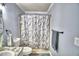 Updated bathroom features a shower/tub combo, modern vanity, and updated fixtures at 86 Winter Ridge Rd # 86, Winter Haven, FL 33881