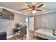 Versatile bedroom with a workspace, large TV, and ample floor space at 86 Winter Ridge Rd # 86, Winter Haven, FL 33881