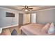 Bedroom with a queen-size bed, ceiling fan, and large closet at 86 Winter Ridge Rd # 86, Winter Haven, FL 33881