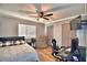Spacious bedroom with large closet, ceiling fan, and room for a workspace at 86 Winter Ridge Rd # 86, Winter Haven, FL 33881