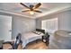 Cozy bedroom with a double bed, ceiling fan, and ample natural light at 86 Winter Ridge Rd # 86, Winter Haven, FL 33881