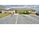 Community building entrance and parking area at 86 Winter Ridge Rd # 86, Winter Haven, FL 33881