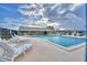 Relaxing community pool with lounge chairs at 86 Winter Ridge Rd # 86, Winter Haven, FL 33881