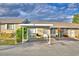 Tan house with carport and landscaping at 86 Winter Ridge Rd # 86, Winter Haven, FL 33881