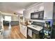 Updated kitchen with white cabinets, new appliances, and stylish backsplash at 86 Winter Ridge Rd # 86, Winter Haven, FL 33881