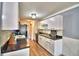 Modern kitchen with white cabinets and black counters at 86 Winter Ridge Rd # 86, Winter Haven, FL 33881