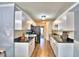 Modern kitchen with white cabinets and black counters at 86 Winter Ridge Rd # 86, Winter Haven, FL 33881
