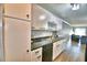 Modern kitchen featuring white cabinets, granite countertops, and dishwasher at 86 Winter Ridge Rd # 86, Winter Haven, FL 33881