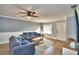 Living room with gray sofas and wood floors at 86 Winter Ridge Rd # 86, Winter Haven, FL 33881