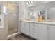 Double vanity bathroom with large shower and plenty of storage at 1042 Corso Dr, Winter Haven, FL 33884
