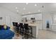 Modern kitchen with stainless steel appliances and breakfast bar at 1042 Corso Dr, Winter Haven, FL 33884
