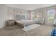Main bedroom with a large bed, dresser, and neutral decor at 1042 Corso Dr, Winter Haven, FL 33884