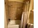 Bathroom with a shower/tub combo and a beige shower curtain at 1068 Stoney Creek Dr, Lakeland, FL 33811