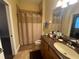 Bathroom with tub shower combo and single vanity at 1068 Stoney Creek Dr, Lakeland, FL 33811