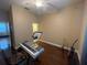 Bright bedroom with hardwood floors and access to a bathroom at 1068 Stoney Creek Dr, Lakeland, FL 33811