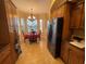 Bright breakfast nook adjacent to the kitchen with a chandelier and natural light from windows at 1068 Stoney Creek Dr, Lakeland, FL 33811
