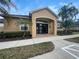 Exterior view of the clubhouse entrance and landscaping at 1068 Stoney Creek Dr, Lakeland, FL 33811