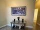 Entryway featuring a mirrored console table, hats, indoor plants, and an attractive wall painting at 1068 Stoney Creek Dr, Lakeland, FL 33811