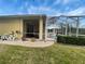 Exterior backyard view of the screened-in pool and patio area at 1068 Stoney Creek Dr, Lakeland, FL 33811