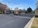 Stoney Creek subdivision entrance, featuring black iron gates and stone pillars on a freshly paved road at 1068 Stoney Creek Dr, Lakeland, FL 33811