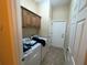 Laundry room with washer, dryer, and built-in cabinets at 1068 Stoney Creek Dr, Lakeland, FL 33811