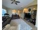 Open living area with comfortable seating, a ceiling fan, tile floors, and ample natural light at 1068 Stoney Creek Dr, Lakeland, FL 33811