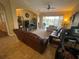 Spacious living room featuring comfortable seating, a ceiling fan, tile floors, and outdoor access at 1068 Stoney Creek Dr, Lakeland, FL 33811