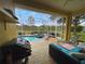 Outdoor screened-in pool and patio area with beautiful outdoor furniture at 1068 Stoney Creek Dr, Lakeland, FL 33811