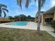 Community pool with chairs and nearby landscaping at 1068 Stoney Creek Dr, Lakeland, FL 33811