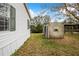 Home with detached shed and grassy backyard at 13901 Hatchineha Rd, Haines City, FL 33844