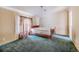 Simple bedroom with a double bed and green carpet at 13901 Hatchineha Rd, Haines City, FL 33844