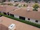 Aerial view of houses with brown roofs and lush green landscaping at 1649 Linz Ct, Winter Haven, FL 33884